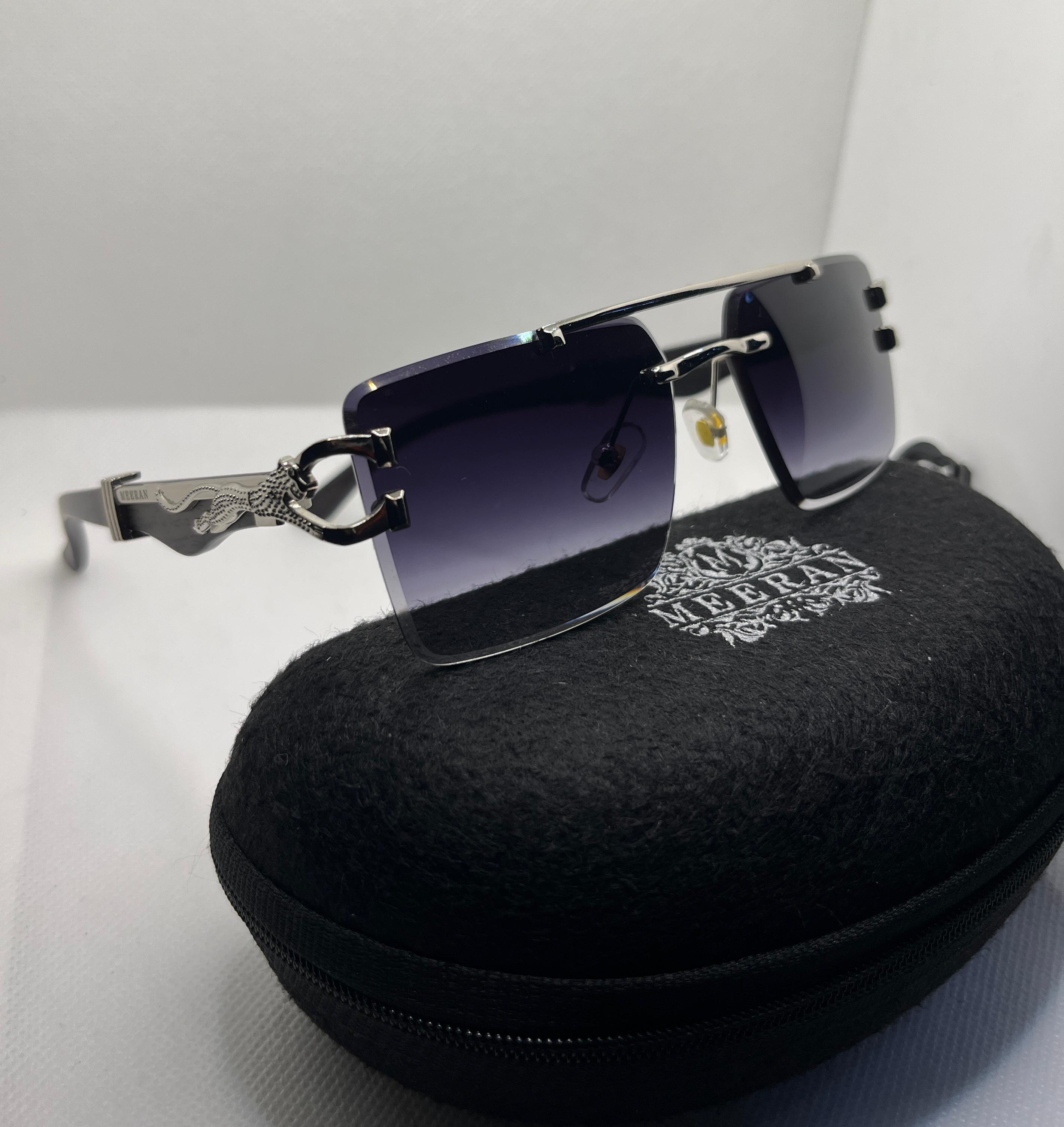 Meeran jaguar sunglasses with blue lenses and a black/Silver frame, featuring UV protection